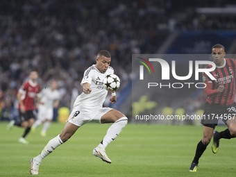 Kylian Mbappe of Real Madrid controls the ball during the UEFA Champions League 2024/25 match between Real Madrid and AC Milan at Santiago B...