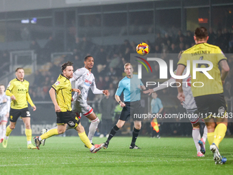 Elliot Watt of Burton Albion and Joy Mukena of Crawley Town race after the ball during the Sky Bet League 1 match between Burton Albion and...