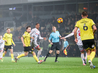 Elliot Watt of Burton Albion and Joy Mukena of Crawley Town race after the ball during the Sky Bet League 1 match between Burton Albion and...