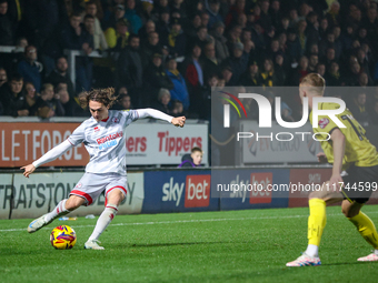 Harry Forster of Crawley Town sets up a cross during the Sky Bet League 1 match between Burton Albion and Crawley Town at the Pirelli Stadiu...