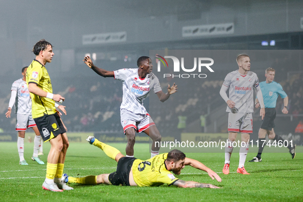 #12, Panutche Camara of Crawley Town (center) attempts a shot on goal during the Sky Bet League 1 match between Burton Albion and Crawley To...