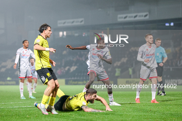 #12, Panutche Camara of Crawley Town (center) attempts a shot on goal during the Sky Bet League 1 match between Burton Albion and Crawley To...