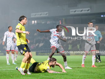 #12, Panutche Camara of Crawley Town (center) attempts a shot on goal during the Sky Bet League 1 match between Burton Albion and Crawley To...