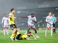 #12, Panutche Camara of Crawley Town (center) attempts a shot on goal during the Sky Bet League 1 match between Burton Albion and Crawley To...