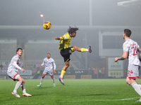 Romelle Donovan of Burton Albion goes airborne as he attempts to clear the ball during the Sky Bet League 1 match between Burton Albion and...