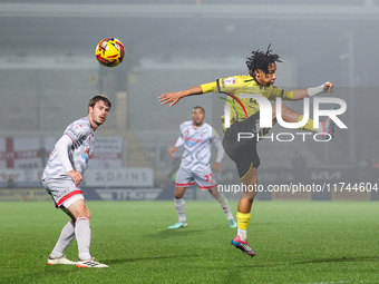 Romelle Donovan of Burton Albion goes airborne as he attempts to clear the ball during the Sky Bet League 1 match between Burton Albion and...