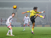 Romelle Donovan of Burton Albion goes airborne as he attempts to clear the ball during the Sky Bet League 1 match between Burton Albion and...