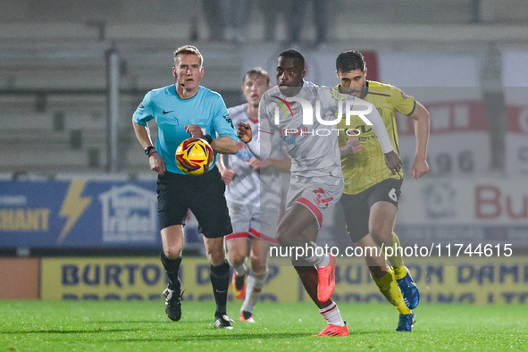 Ade Adeyemo of Crawley Town races forward after the ball during the Sky Bet League 1 match between Burton Albion and Crawley Town at the Pir...