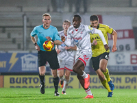 Ade Adeyemo of Crawley Town races forward after the ball during the Sky Bet League 1 match between Burton Albion and Crawley Town at the Pir...