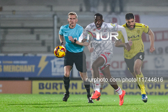 Ade Adeyemo of Crawley Town races forward after the ball during the Sky Bet League 1 match between Burton Albion and Crawley Town at the Pir...