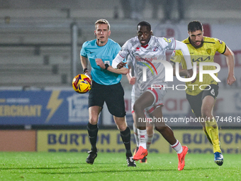 Ade Adeyemo of Crawley Town races forward after the ball during the Sky Bet League 1 match between Burton Albion and Crawley Town at the Pir...