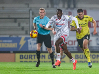 Ade Adeyemo of Crawley Town races forward after the ball during the Sky Bet League 1 match between Burton Albion and Crawley Town at the Pir...