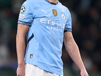 Erling Haaland of Manchester City reacts after missing a penalty kick during the UEFA Champions League match between Sporting CP and Manches...