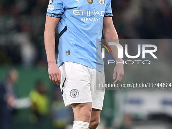 Erling Haaland of Manchester City reacts after missing a penalty kick during the UEFA Champions League match between Sporting CP and Manches...