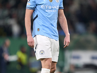 Erling Haaland of Manchester City reacts after missing a penalty kick during the UEFA Champions League match between Sporting CP and Manches...