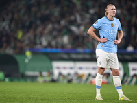 Erling Haaland of Manchester City reacts after missing a penalty kick during the UEFA Champions League match between Sporting CP and Manches...