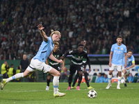 Erling Haaland of Manchester City takes a penalty kick during the UEFA Champions League match between Sporting CP and Manchester City at Jos...