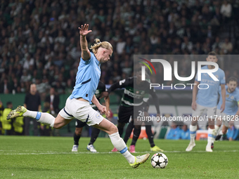 Erling Haaland of Manchester City takes a penalty kick during the UEFA Champions League match between Sporting CP and Manchester City at Jos...