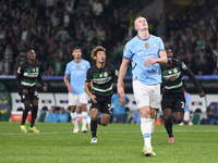 Erling Haaland of Manchester City reacts after missing a penalty kick during the UEFA Champions League match between Sporting CP and Manches...