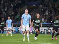 Erling Haaland of Manchester City reacts after missing a penalty kick during the UEFA Champions League match between Sporting CP and Manches...