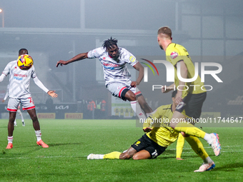 The shot by #29, Tola Showunmi of Crawley Town, is blocked during the Sky Bet League 1 match between Burton Albion and Crawley Town at the P...