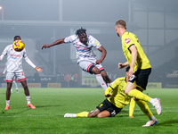 The shot by #29, Tola Showunmi of Crawley Town, is blocked during the Sky Bet League 1 match between Burton Albion and Crawley Town at the P...