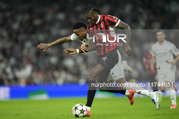 Rafael Leao left winger of AC Milan and Portugal and Eder Militao centre-back of Real Madrid and Brazil compete for the ball during the UEFA...