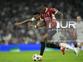 Rafael Leao left winger of AC Milan and Portugal and Eder Militao centre-back of Real Madrid and Brazil compete for the ball during the UEFA...