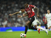 Rafael Leao left winger of AC Milan and Portugal and Eder Militao centre-back of Real Madrid and Brazil compete for the ball during the UEFA...