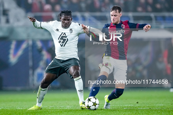 Breel Embolo of AS Monaco and Sam Beukema of Bologna FC compete for the ball during the UEFA Champions League 2024/25 League Phase MD4 match...