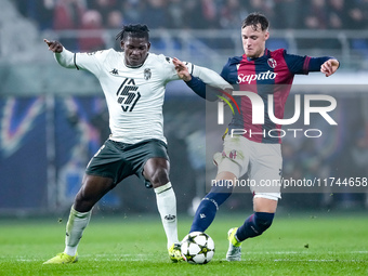 Breel Embolo of AS Monaco and Sam Beukema of Bologna FC compete for the ball during the UEFA Champions League 2024/25 League Phase MD4 match...