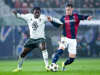 Breel Embolo of AS Monaco and Sam Beukema of Bologna FC compete for the ball during the UEFA Champions League 2024/25 League Phase MD4 match...