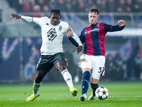 Breel Embolo of AS Monaco and Sam Beukema of Bologna FC compete for the ball during the UEFA Champions League 2024/25 League Phase MD4 match...