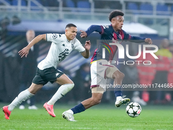 Dan Ndoye of Bologna FC and Vanderson of AS Monaco compete for the ball during the UEFA Champions League 2024/25 League Phase MD4 match betw...