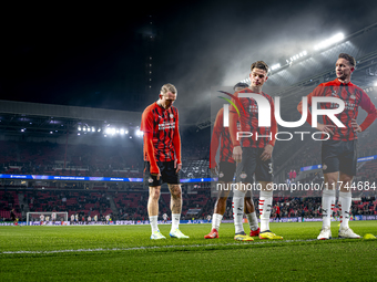 PSV Eindhoven defender Matteo Dams and PSV Eindhoven forward Luuk de Jong participate in the match between PSV and Girona at the Philips Sta...