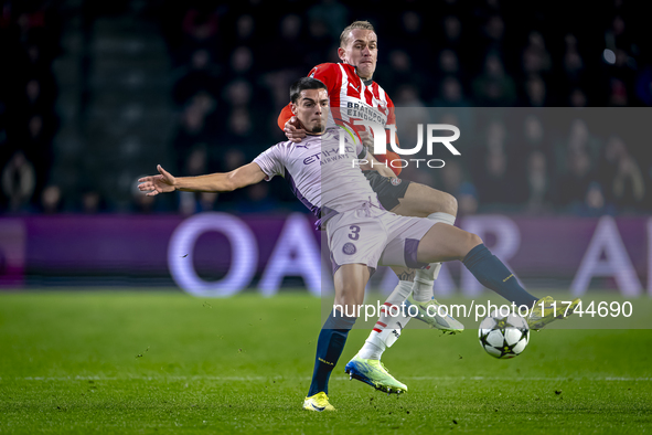 Girona FC defender Miguel Gutierrez and PSV Eindhoven defender Rick Karsdorp play during the match between PSV and Girona at the Philips Sta...