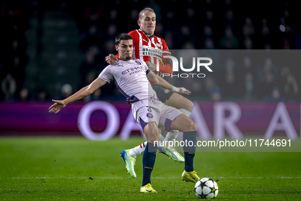 Girona FC defender Miguel Gutierrez and PSV Eindhoven defender Rick Karsdorp play during the match between PSV and Girona at the Philips Sta...