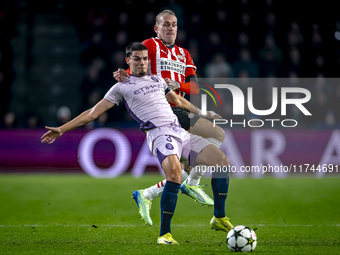 Girona FC defender Miguel Gutierrez and PSV Eindhoven defender Rick Karsdorp play during the match between PSV and Girona at the Philips Sta...