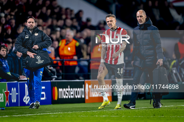 PSV Eindhoven forward Noa Lang becomes injured and leaves the pitch during the match between PSV and Girona at the Philips Stadium for the U...