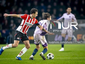 PSV Eindhoven defender Olivier Boscagli and Girona FC forward Bryan Gil participate in the match between PSV and Girona at the Philips Stadi...