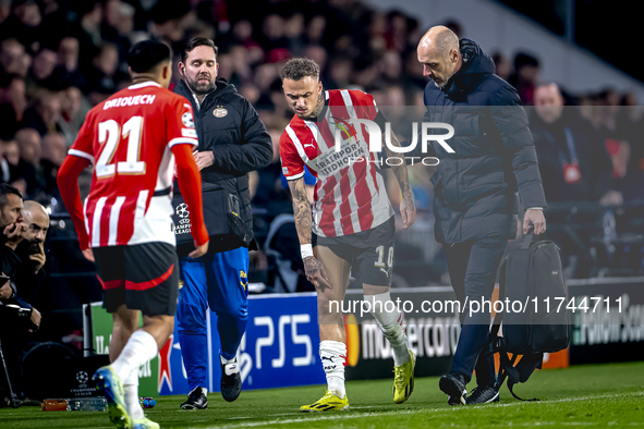 PSV Eindhoven forward Noa Lang becomes injured and leaves the pitch during the match between PSV and Girona at the Philips Stadium for the U...