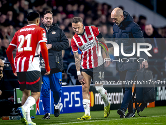 PSV Eindhoven forward Noa Lang becomes injured and leaves the pitch during the match between PSV and Girona at the Philips Stadium for the U...