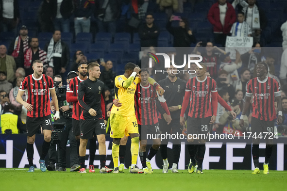 Milan players celebrate victory after the UEFA Champions League 2024/25 League Phase MD4 match between Real Madrid C.F. and AC Milan at Esta...