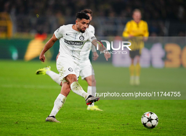 Jusuf Gazibegovic of SK Sturm Graz  shoots on goal during the Champions League Round 4 match between Borussia Dortmund v SK Sturm Graz at th...