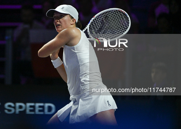 RIYADH, SAUDI ARABIA - NOVEMBER 05: Iga Swiatek of Poland during her match against Coco Gauff of USA, on day 4 of the 2024 WTA Finals, part...