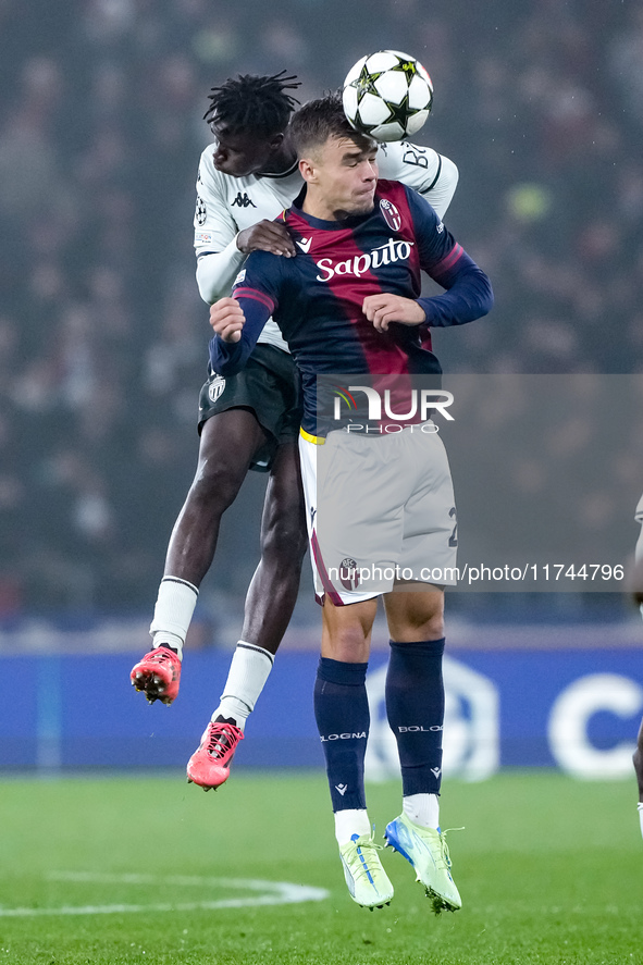 Thijs Dallinga of Bologna FC and Wilfried Singo of AS Monaco jump for the ball during the UEFA Champions League 2024/25 League Phase MD4 mat...