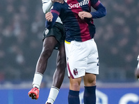 Thijs Dallinga of Bologna FC and Wilfried Singo of AS Monaco jump for the ball during the UEFA Champions League 2024/25 League Phase MD4 mat...