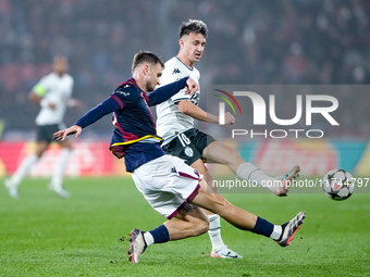 Stefan Posch of Bologna FC and Aleksandr Golovin of AS Monaco compete for the ball during the UEFA Champions League 2024/25 League Phase MD4...