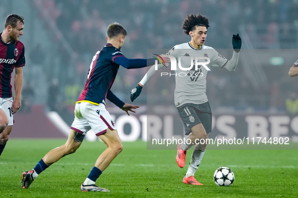 Maghnes Akliouche of AS Monaco and Stefan Posch of Bologna FC compete for the ball during the UEFA Champions League 2024/25 League Phase MD4...