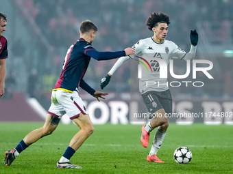 Maghnes Akliouche of AS Monaco and Stefan Posch of Bologna FC compete for the ball during the UEFA Champions League 2024/25 League Phase MD4...